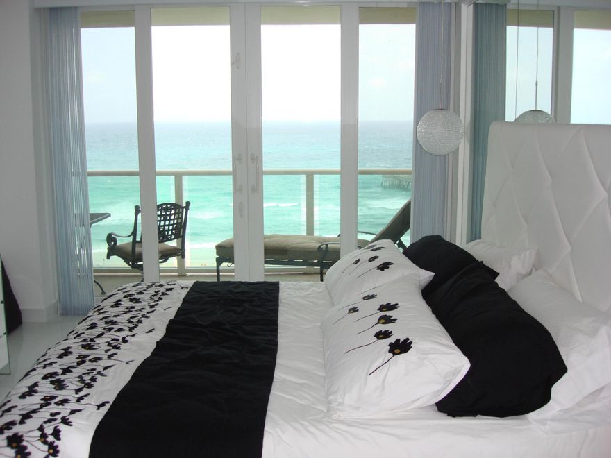COME TO PARADISE! Gorgeous one-bedroom, 1.5-bath oceanfront condo with panoramic Atlantic views from every room. High-end finishes include granite countertops, porcelain tile floors, and top-of-the-line Frigidaire Gallery appliances. Interior highlights: dry bar, wine cooler, dual sinks, spacious walk-in closet, full-size washer/dryer, plus newer A/C and water heater. Building amenities feature a heated pool, BBQ area with dining, clubhouse, gym, direct beach access, and nearby Deerfield Beach International Pier. Ideally located near Boca Raton and within walking distance to supermarkets, restaurants and the boardwalk, this unit epitomizes luxury coastal living.