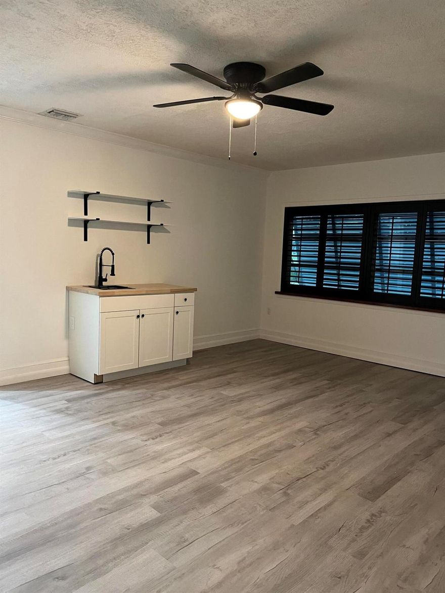 Charming efficiency apartment approximately 300 sq. ft. with a private entrance in a peaceful Jensen Beach neighborhood--no HOA! This unfurnished studio offers a full bathroom, refrigerator, and microwave. Enjoy the convenience of all utilities included--electric, water, and lawn care. The unit features its own A/C.  Pets are welcome, but NO SMOKING. Annual lease only. Located close to beaches, shopping, dining, and vibrant downtown Jensen Beach.