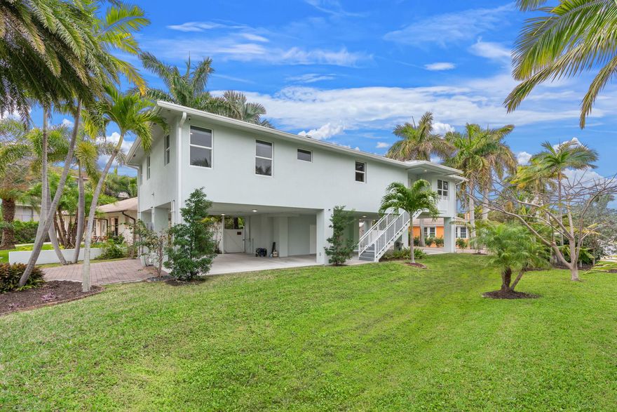 2021 new construction gem just one block from the Intracoastal! This truly unique home is thoughtfully elevated for enhanced views, efficiency, and peace of mind. Featuring full impact windows and doors, the property is flooded with natural light, creating a bright and inviting atmosphere throughout. Situated on an oversized lot with NO HOA, this home offers flexibility and freedom for homeowners and investors alike. A rare opportunity in a prime location—perfect as a primary residence, vacation home, or income-producing property.