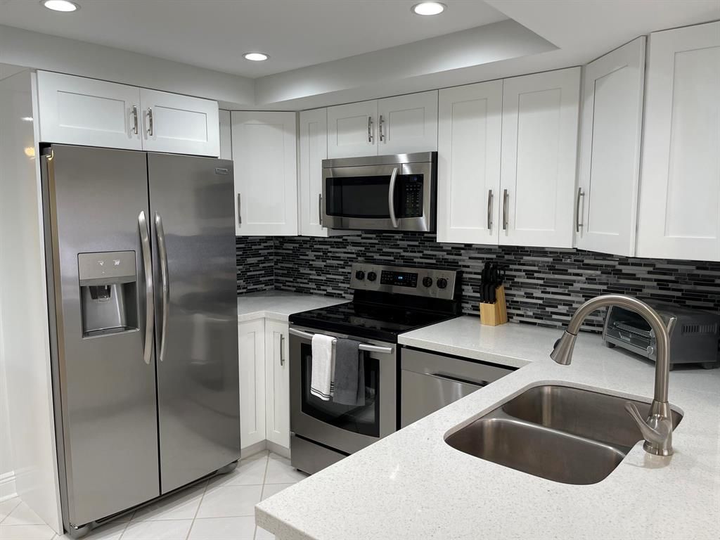 Photo of 1660 Twelve Oaks Way Way #203, North Palm Beach, FL 33408 (MLS # R10752032)