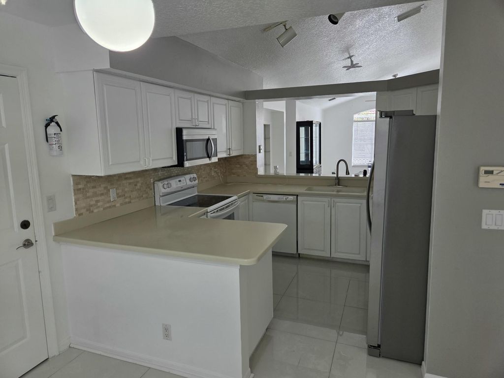 Photo of 3021 Casa Rio Court, Riviera Beach, FL 33418 (MLS # R11142240)