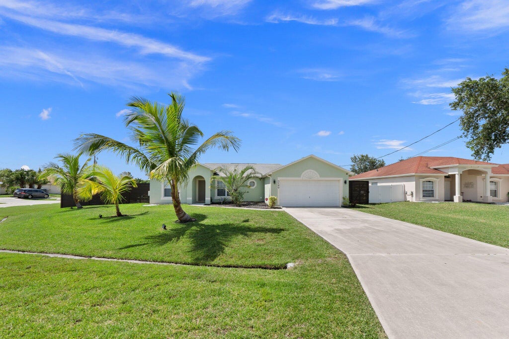 Photo of 5789 NW Belwood Circle, Port Saint Lucie, FL 34986 (MLS # R11140426)