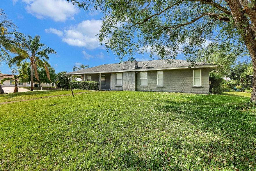 Great home on corner lot located in the heart of Port Saint Lucie.  Make this oversized 3 bedroom 2 bath your own.  Over 1/4 acre yard leaves room for a pool. Under air square footage very generous for the layout.  Amazing entertainment spaces with the kitchen in the middle for convenient gathering! Great home on corner lot located in the heart of Port Saint Lucie.  Make this oversized 3 bedroom 2 bath your own.  Over 1/4 acre yard leaves room for a pool. Under air square footage very generous for the layout.  Amazing entertainment spaces with the kitchen in the middle for convenient gathering!