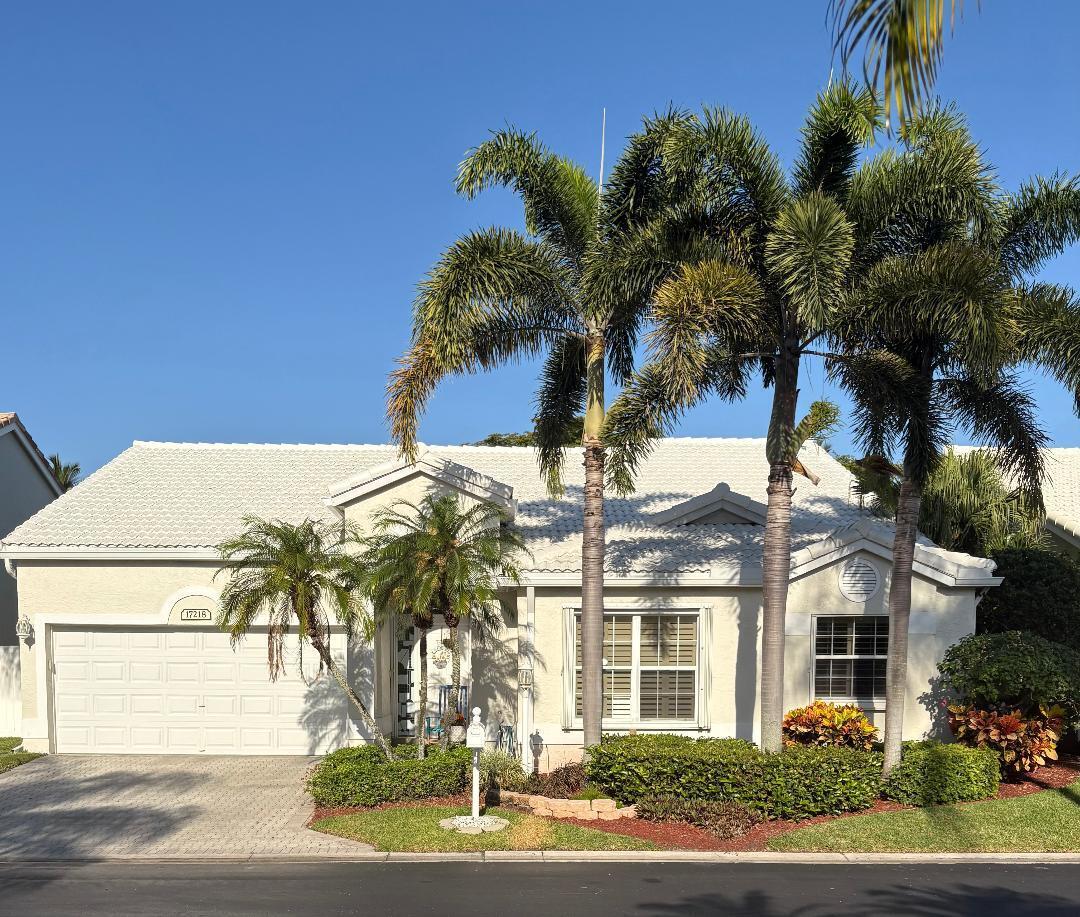 This updated 4-bedroom, 2-bath Boca Raton home features granite kitchen countertops, a spacious pantry, and a remodeled master bath with double sinks and a walk-in shower. The second bath includes a jacuzzi tub. The open layout showcases 18'' diagonal tile flooring throughout. Relax in the covered, screened lanai or on the outdoor patio. Upgrades include a new (2024) tile roof with solar lights, hurricane-proof windows in the family room, and accordion shutters elsewhere. Option to purchase fully furnished. Community amenities include a pool, easy access to shopping, dining, beaches, top-rated schools. The development is nested in Boca Raton Public Golf Course with a grill room and no membership required. Security provided by a gated entrance and 24-hour guarded gatehouse. Welcome Home!