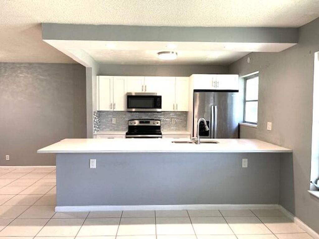 Photo of 580 High Point Drive #B, Delray Beach, FL 33445 (MLS # B26023357)