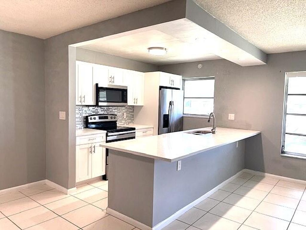 Photo of 580 High Point Drive #B, Delray Beach, FL 33445 (MLS # B26023357)