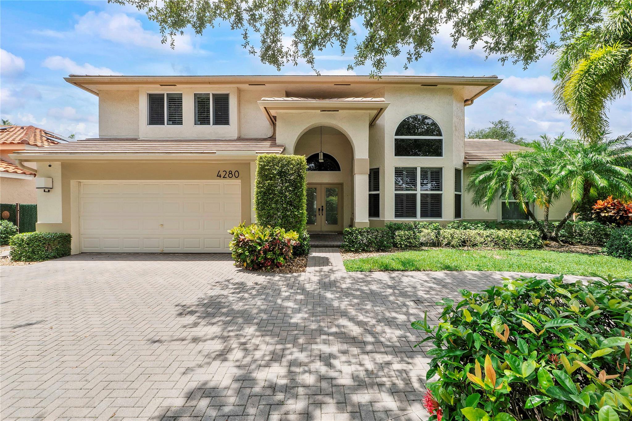 Beautiful 4 bed 3 bath pool home in Winston Park Coconut Creek. Upon entering you are greeted by soaring ceilings & tons of natural light. Wood look tile on the first floor & newer LVP on the 2nd floor. All doors & windows on the front are impact. All other windows have accordion shutters. Roof 2016. ACs 2019. Eat in kitchen features granite counters and stainless appliances. Gorgeous pool overlooks the fully fenced turf yard. Primary bedroom downstairs features large walk-in closet, remodeled bathroom w/ dual vanity, big step-in shower & separate soaking tub. Cabana bath w/ easy access to the pool. 3 nicely sized rooms upstairs w/ newly remodeled bathroom. Large laundry room w/ plenty of storage. Huge circular driveway can accommodate many cars. Great location, close to all major highways