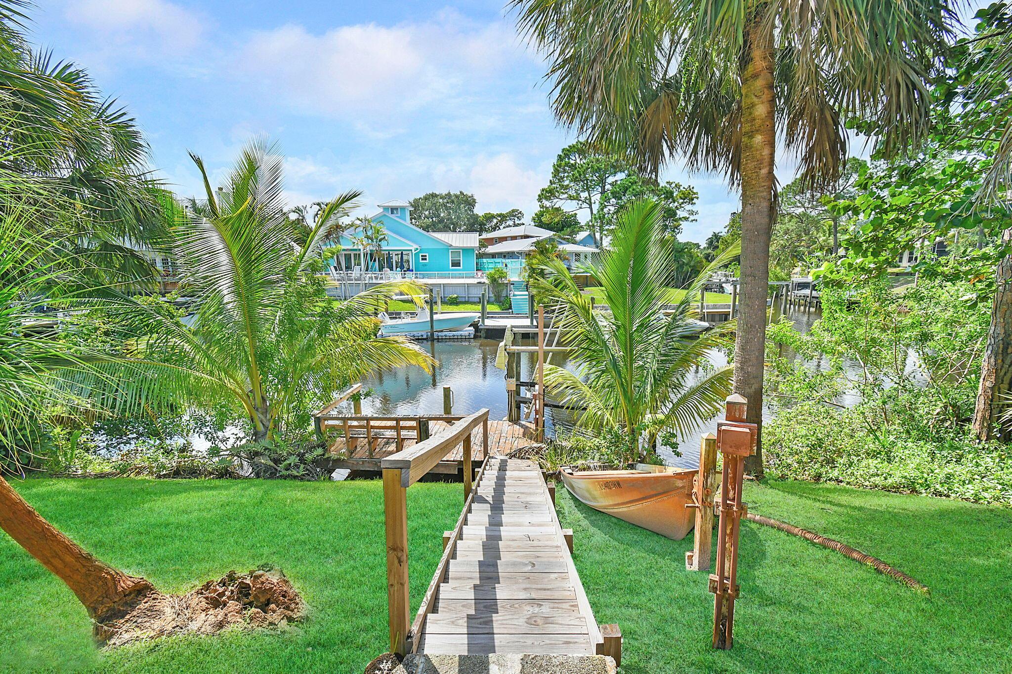 Charming waterfront seasonal rental with dock and boatlift. This 3 bedroom and 2 bath home has plenty of room for friends and family. Take a dip in the pool and enjoy time in the screened lanai and covered patio. Highly desirable Palm City. Close to shopping and dining. Easy access from I-95 and Florida Turnpike.