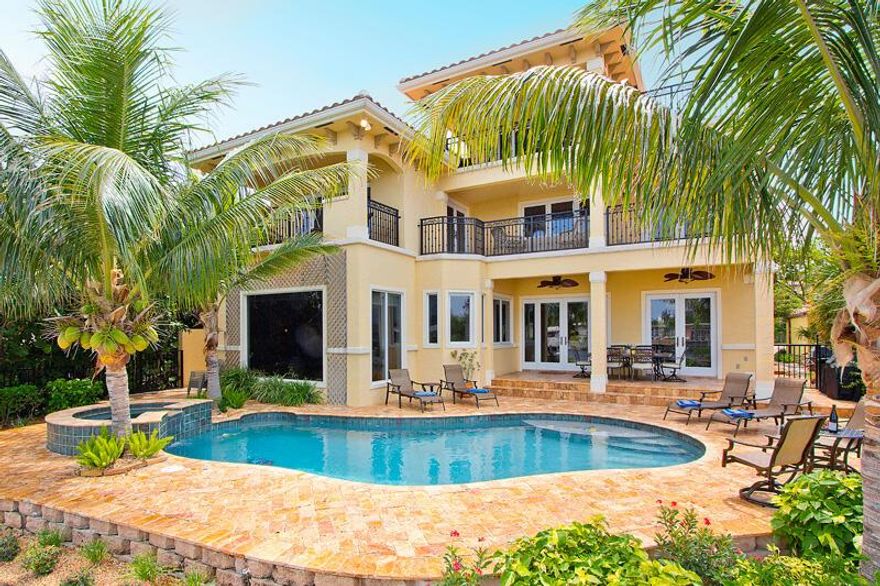 BEST DEAL ON THE INTRACOASTAL! If you are in the market for a waterfront home, this is a must see! This Waterfront Luxury Estate is a spectacular 5,600+ sq ft estate situated directly on the east, beachfront side of the iconic Intracoastal Waterway. This classic Mediterranean South Florida dream villa presents panoramic views and easy beach/water access in a setting that is lush and exclusive. 6 bedrooms and 4.5 bathrooms in a spacious 3-story design allows ample room and an inspiring sense of freedom and comfort. Luxury manor architectural touches include dramatic vaulted ceilings, gorgeous hardwood floors of genuine Brazilian cherry, and delightful crown molding. No fewer than 5 terraces throughout overlook the Intracoastal.

The master bedroom includes two of those scenic terraces, along with his-and-her walk-in closets and an ultimate luxury bathroom featuring Saturnia marble floors with mosaic accents, a whirlpool spa tub, a bidet, a walk-in shower, and dual toilets and sinks. On the third floor is an extra family/living room, which is perfect as a dedicated TV/Movie theater, or simply a great space for anyone who has kids that would love to have a separate playroom. 

The backyard area is designed to impress, including heated pool & spa, covered outdoor grill area, and spacious alfresco seating. A private dock provides convenient Intracoastal access. The rear entertaining area faces west and at the end of your day offers unobstructed sunset views that are gorgeous, romantic, and unforgettable.

Deerfield Beach is the epicenter of the active South Florida surf, sun & sand scene, including the best and friendliest local beach for surfing. Overall, it is just a fun and exciting neighborhood to live in that includes a fishing pier, a great beach with public volleyball courts, fine dining with waterfront restaurants, cafes, shops, scuba & snorkeling, and watercraft rentals. So, come on down and check this luxury waterfront home in one of South Florida's great neighborhoods.