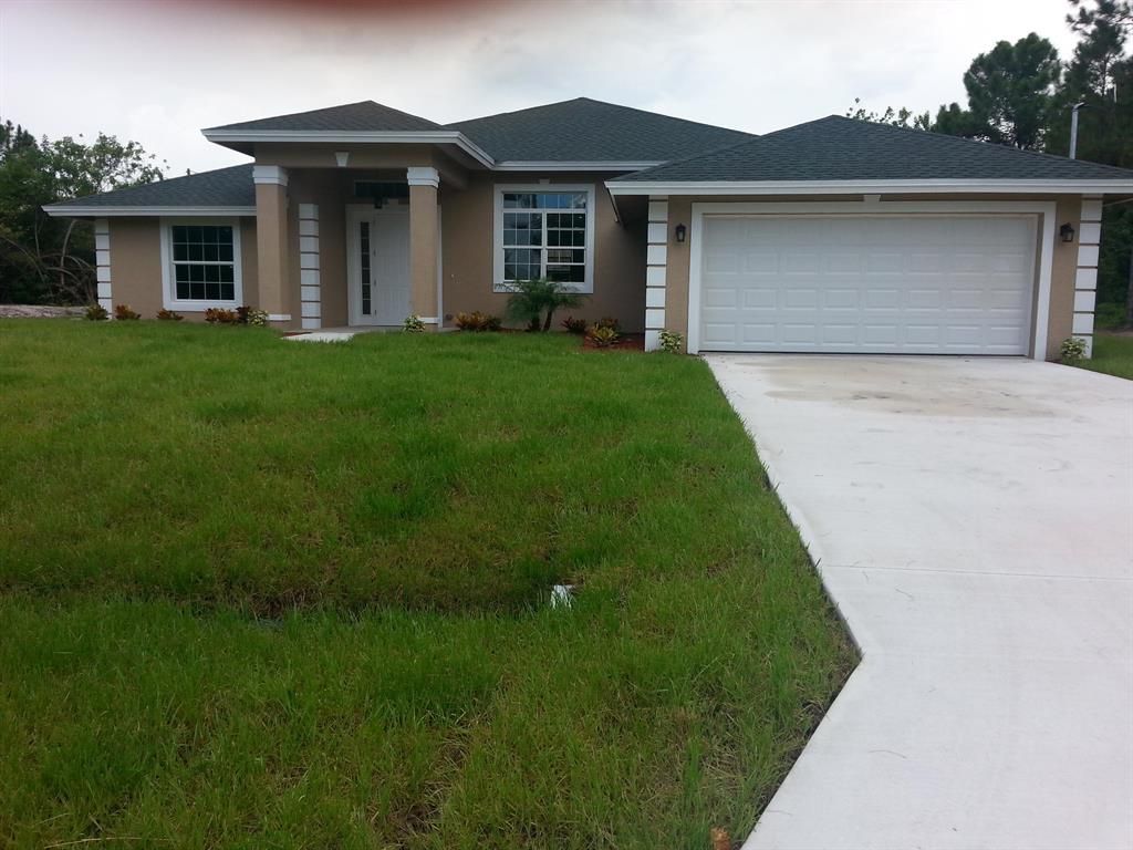 Photo of 6134 NW Drophy Avenue, Port Saint Lucie, FL 34986 (MLS # R10728855)