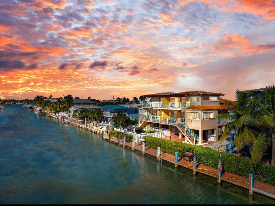Discover elevated island living at 541 8th St, Key Colony Beach--a stunning stilted 1/2-duplex offering 3 beds, 3.5 baths, and 1,830 sq ft of well-designed space. Positioned on a 37.5-ft canal, it provides direct ocean access for world-class fishing, diving, and boating. The Spanish tile roof and light-filled open layout blend coastal style with modern comfort. Enjoy water-view balconies ideal for dining and sunsets, off the main-level dining room, and an upper primary retreat with panoramic canal views. The elevated design towers above the neighboring homes. Ample parking, storage, and breezy outdoor space below. Perfect as a full-time home, vacation escape, or investment--experience true island living in this Key Colony Beach gem!