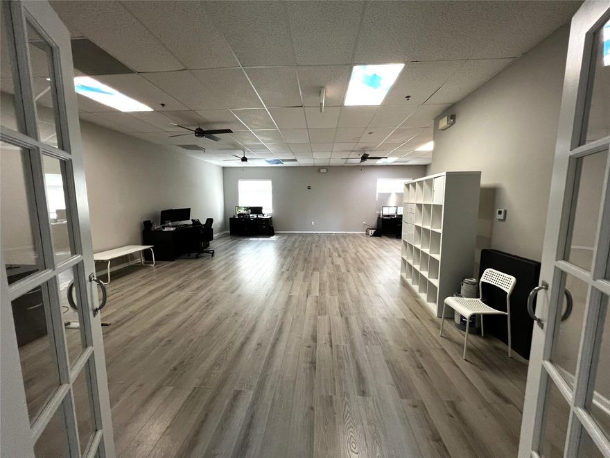 -1,500 SF office condo, ideal for Owner-User or Investor-Tenant in place — Can stay or vacate (out-clause in place)-Two bright, spacious, private offices with windows- French doors open to a large open bullpen area-Includes one ADA-compliant restroom-Solid 2004 tilt-wall construction with impact glass & fire sprinklers