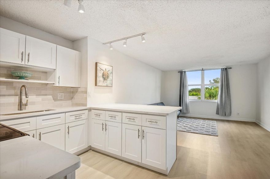 All new kitchen & floors and only a block to the Beach.  This is a fantastic location! This top floor condo is in a quiet boutique building on the corner of a Residential beachside neighborhood on the East side of A1A. Close to popular restaurants, nightlife and stores with a new Publix across the street. This is a very desirable and vibrant location.
