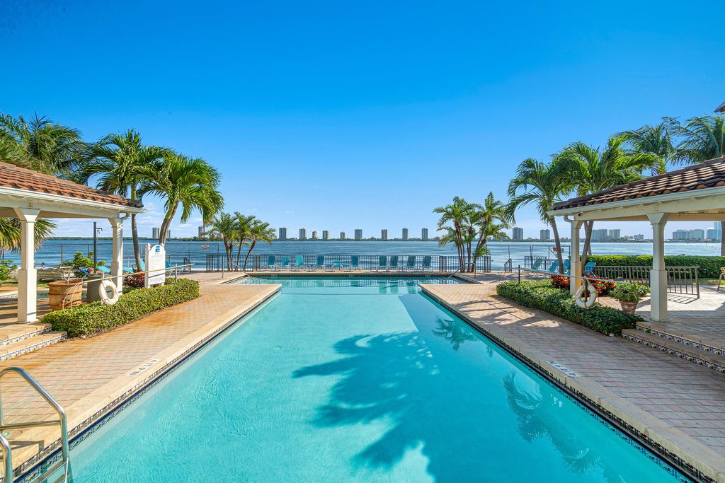 Photo of 1140 Lake Shore 202 Drive #202, Lake Park, FL 33403 (MLS # R11059407)