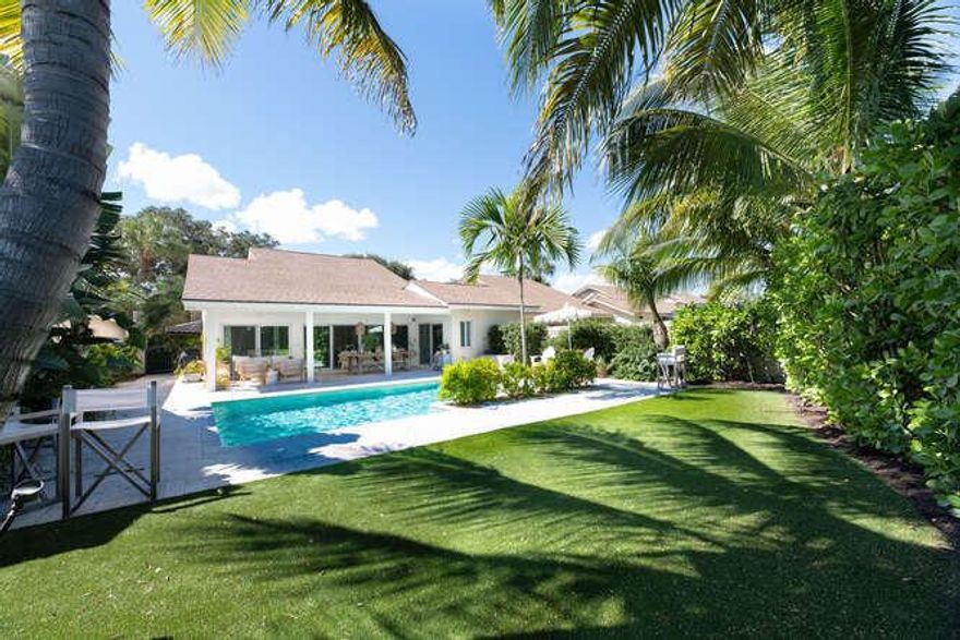 A RARE GEM! Just a short distance from the beach you will find this beautiful 4 bedroom 3 bathroom turnkey residence. This coastal charmer welcomes you with a calming vibe & serene atmosphere. Completely renovated in 2017, this home added a flex space & additional ensuite bedroom that could be used as a second master.  This home features an open layout with many custom touches including hardwood floors, open shelving, shiplap walls, barn doors, and brass & rattan light fixtures. Enjoy entertaining in this bright & airy kitchen which opens to the great room & dining area, creating a perfect space for gathering. Open the pocket sliders to the extended covered lanai & you find a comfortable additional living & dining space. The perfect spot to welcome in the ocean breezes and relax. Just beyond the lanai is a heated salt-water pool and an oversized yard with lush landscaping and a turf lawn for low maintenance living. Privacy throughout and gorgeous lake views directly on the eastern side of the residence.  This concrete block home is complete with impact glass doors & windows, a new water heater, newer HVAC systems and a rare extended patio. The two-car garage allows for parking with ease. The neighborhood offers a community pool, putting green, tennis & paddle courts with very low HOA dues. Close proximity to the beach, dog park, dog friendly Juno Beach, marina or intracoastal to watch the boats go by.
This move-in ready upgraded home with prime location makes it a one-of-a-kind residence. Call today for your private showing!