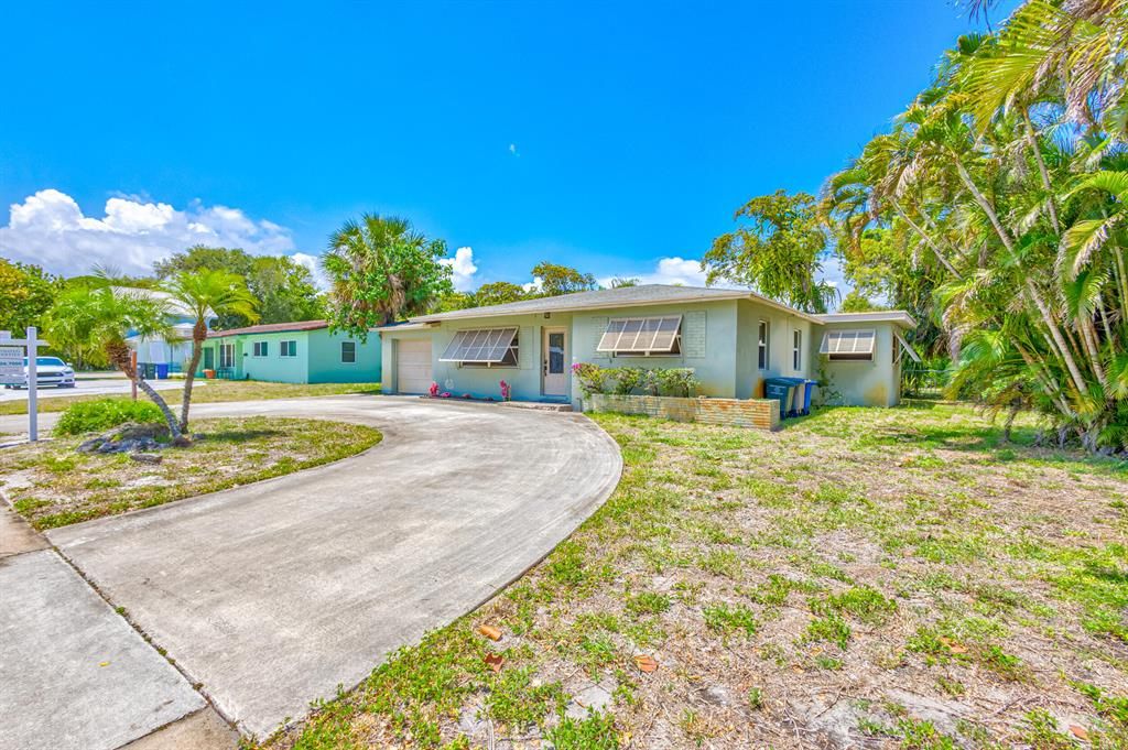 Photo of 315 Park Avenue, Lake Park, FL 33403 (MLS # R10889649)