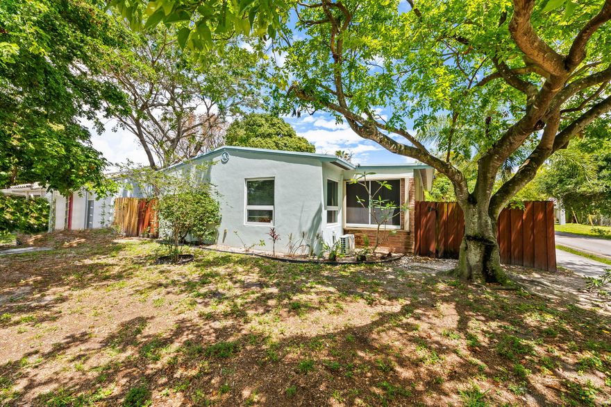 Discover the perfect blend of mid-century charm and modern updates with this income-generating duplex in the South Middle River community. Situated on a spacious corner lot, this property is a standout opportunity for savvy investors or an owner-occupant looking to live in one unit while offsetting their mortgage with rental income. This maintained duplex features two spacious 1-bedroom, 1-bathroom units, each offering: full impact windows and doors throughout, each unit boasts tile flooring, both units feature their own private, screened-in porch, perfect for enjoying the South Florida breeze, a fully fenced backyard with lush tropical landscaping offers a serene garden retreat for tenants, an on-site shared laundry facility and ample off-street parking for up to 4 vehicles.