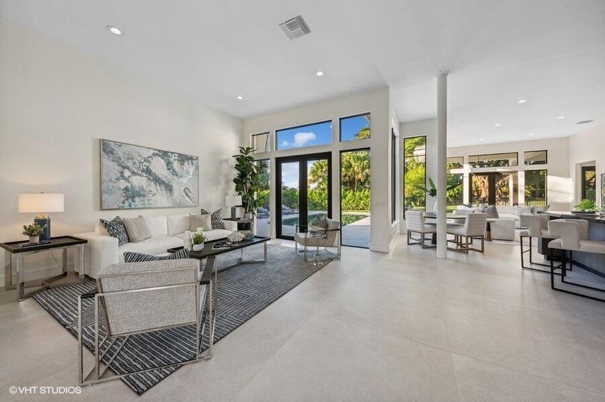 A spectacular house situated in a highly sought-after corner lot in Ballenisles. Ideal for entertaining, relaxing, and everyday living. Offering a newly renovated 6 bedroom, 5.5 bathroom, 2 story house with new roof, impact windows, 3 car garage and pool.  This custom home is one-of-a kind at 4,200+ square feet with serene and sprawling views of the lake and beautiful, lush gardens.  Thoughtfully designed, effortlessly stylish.  The felicitous entryway gives way to the generous great room which is adjacent to the spacious custom designed chef's kitchen which features a grand kitchen island with room for a dining room table.