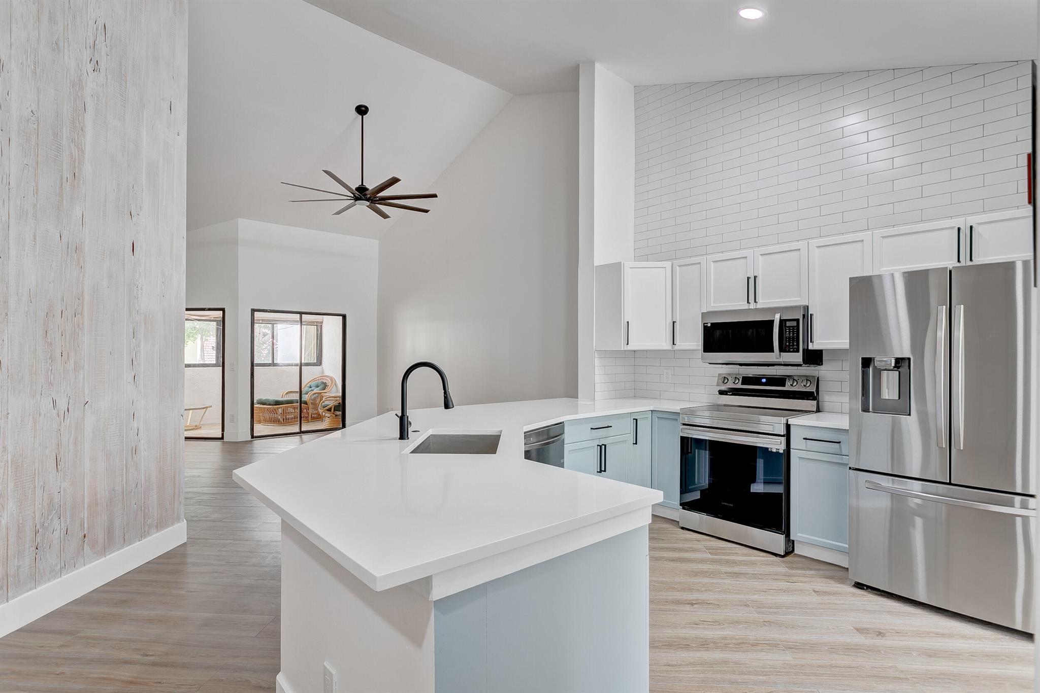 Welcome Home to Your Coastal Escape! Tucked into a beautifully landscaped neighborhood just a 1/2 mile from the beach, this recently renovated 3-bedroom, 2-bath townhome is more than a rental--it's your personal retreat.From the moment you arrive, the easygoing charm of this beach-vibe home invites you to breathe a little deeper and slow down. Step inside and you'll be greeted by soaring high ceilings and an open-concept living space bathed in natural light. The fresh sea-inspired tones and breezy layout create a calming coastal atmosphere that instantly feels like home. The fully updated kitchen features sleek countertops and modern appliances--perfect for sipping coffee as sunlight pours through the windows or cooking up your favorite meals after a day by the shore. The spacious primary