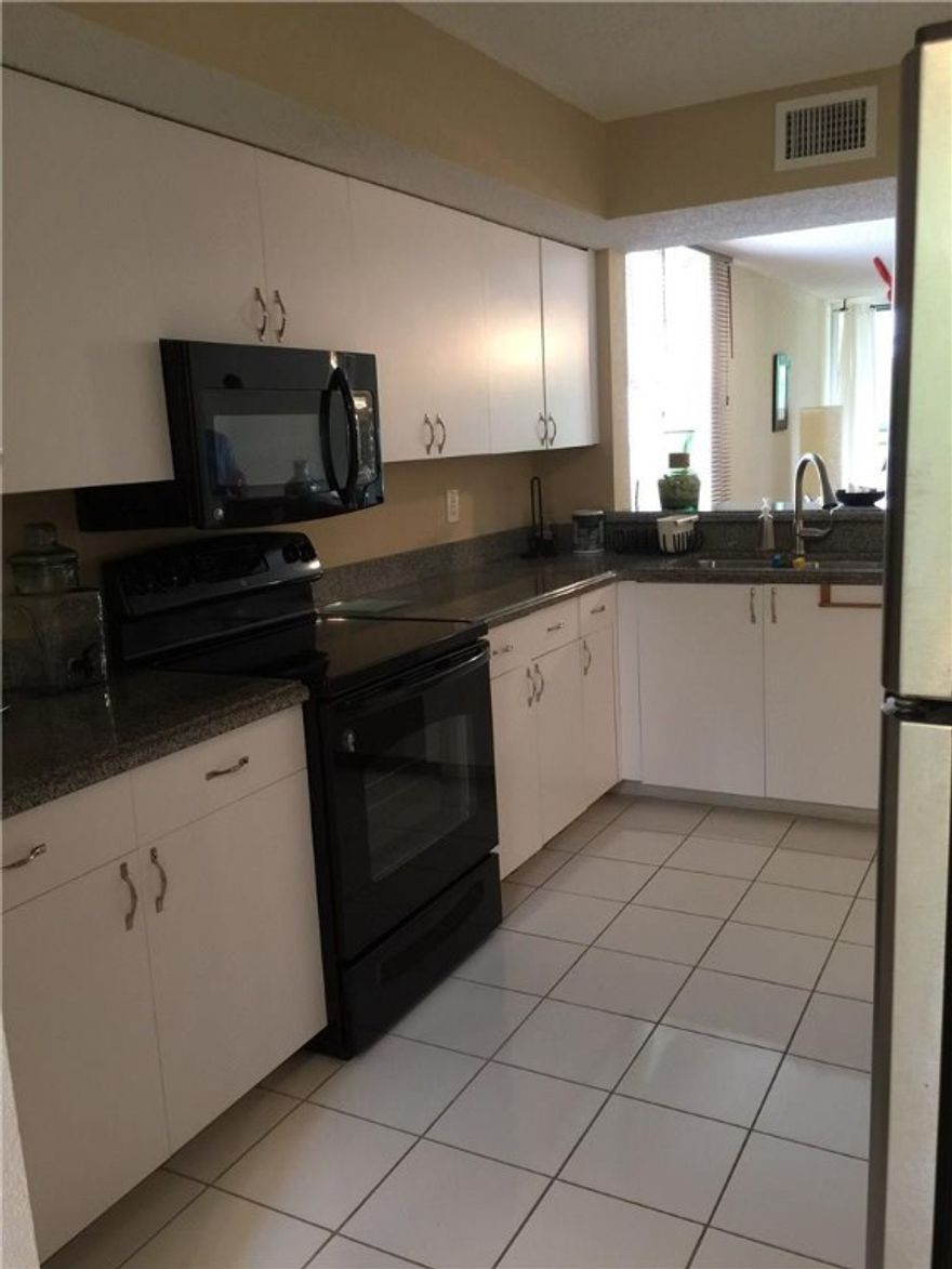 THIS LOVELY 2/2 SECOND FLOOR CORNER UNIT IS A MUST SEE! NOT ONLY IS IT AFFORDABLE, BUT HAS ALL THE BELLS & WHISTLES YOU'D EXPECT! NEWLY RENOVATED KITCHEN WITH SS APPLIANCES, BEAUTIFUL  CABINETRY, GRANITE COUNTERTOPS, AMPLE SIZE EAT-IN KITCHEN; FULL SIZE W/D, & LOTS, LOTS MORE! GREAT SPACIOUS LIVING AREA FACING WONDERFUL GREEN PRESERVE & POOL AREA W/PATIO TO ENJOY THOSE LOVELY BREEZY EVENINGS! SPLIT BEDROOM PLAN OFFERS PRIVACY & EACH BEDROOM HAS IT'S OWN BEAUTIFULLY RENOVATED FULL BATH!