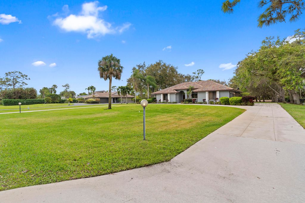 Photo of 9425 Dundee Drive, Lake Worth, FL 33467 (MLS # R11169065)