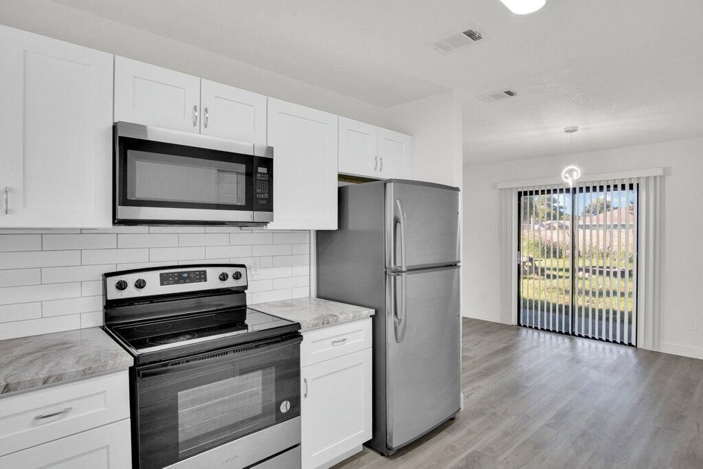 Photo of 2009 SE Mary Terrace, Port Saint Lucie, FL 34952 (MLS # R11133804)