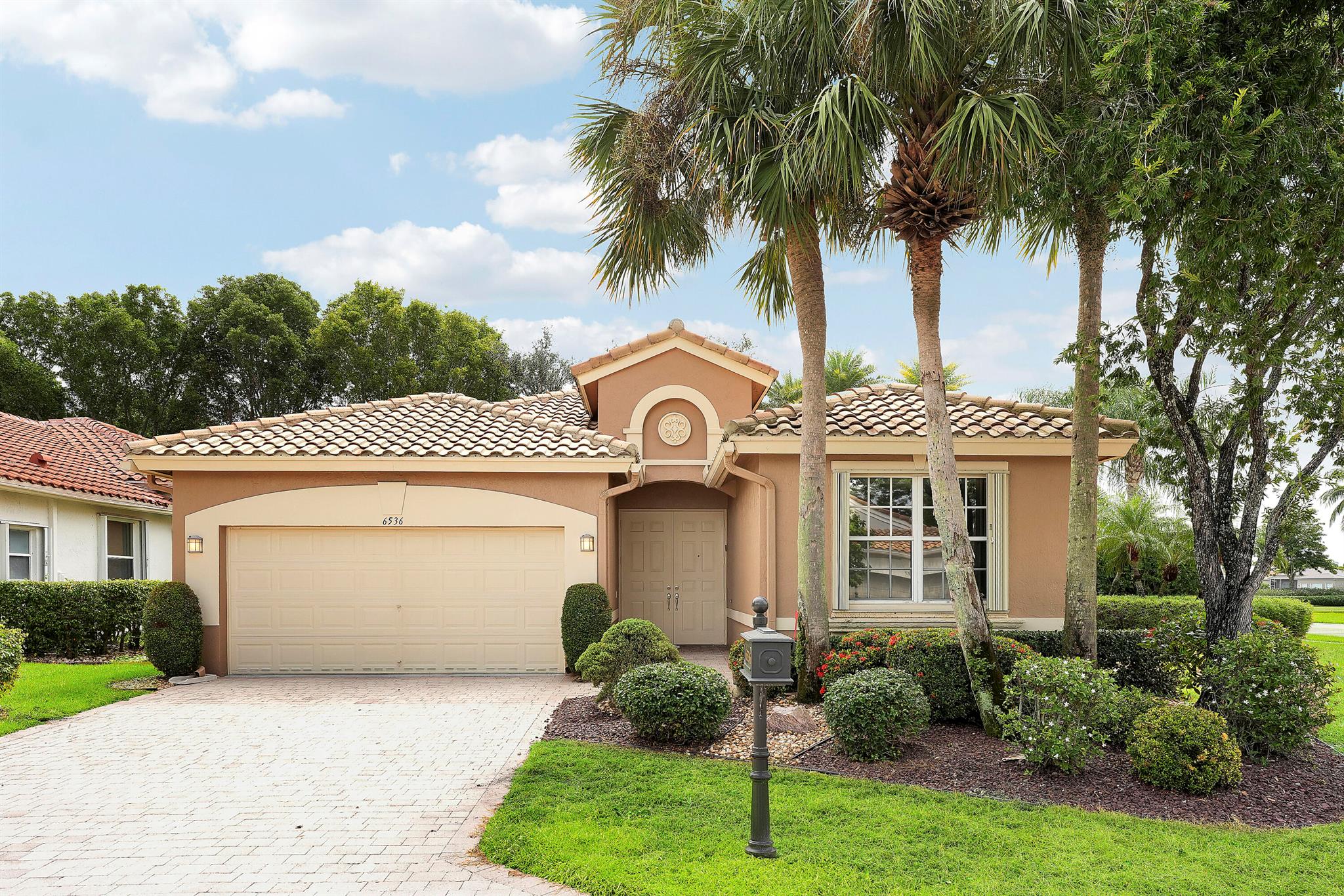 Welcome to Beautiful Bellaggio! This Alexander Model is highly sort after, and one of the most Popular Homes. People love this Layout due to the Open Floor Plan and Breakfast Nook. This is a 3 Bedroom, 2 Bath home in which the 3rd Bedroom is being used as a Den. Kitchen has Bright White Cabinets, Granite Countertops and updated Stainless Steel Appliances. Guest Bedroom & Den have Wood Floors. Master Bathroom & Guest Bathroom have Vanities with Granite Countertops. Master Bathroom has a ''Jacuzzi Tub.'' Washer & Dryer were replaced a few years ago with a Utility Sink inside the Laundry Room. Air Conditioner replaced a year ago. There are Accordion Hurricane Shutters throughout the house. All Built-in Remain with House including the Desk in the Den.