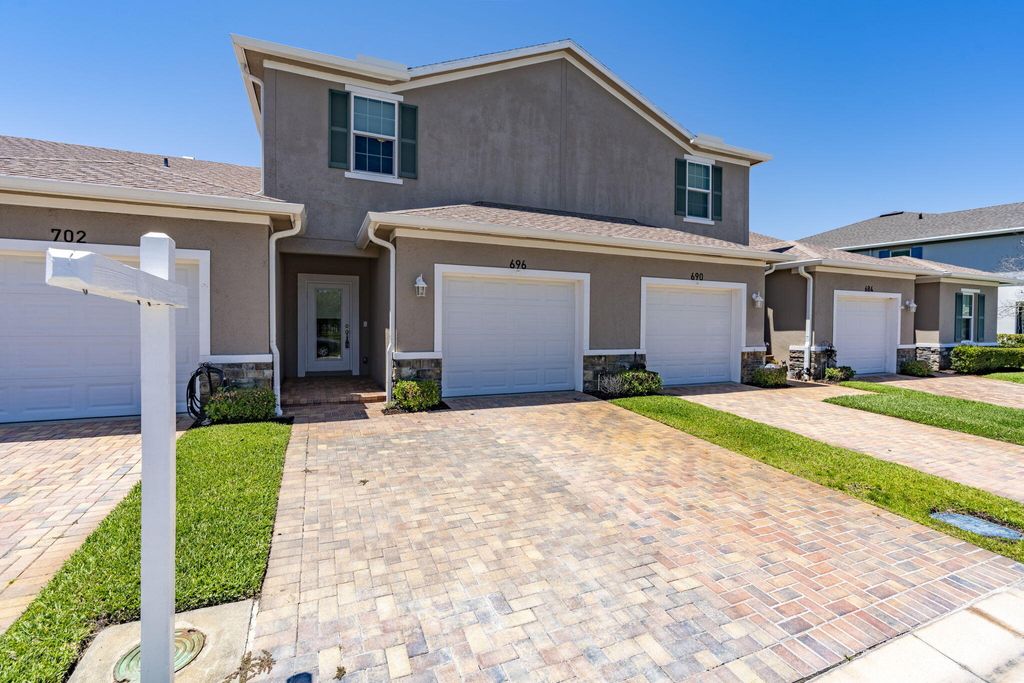 Photo of 696 NE Waters Edge Lane, Port Saint Lucie, FL 34983 (MLS # B26021087)