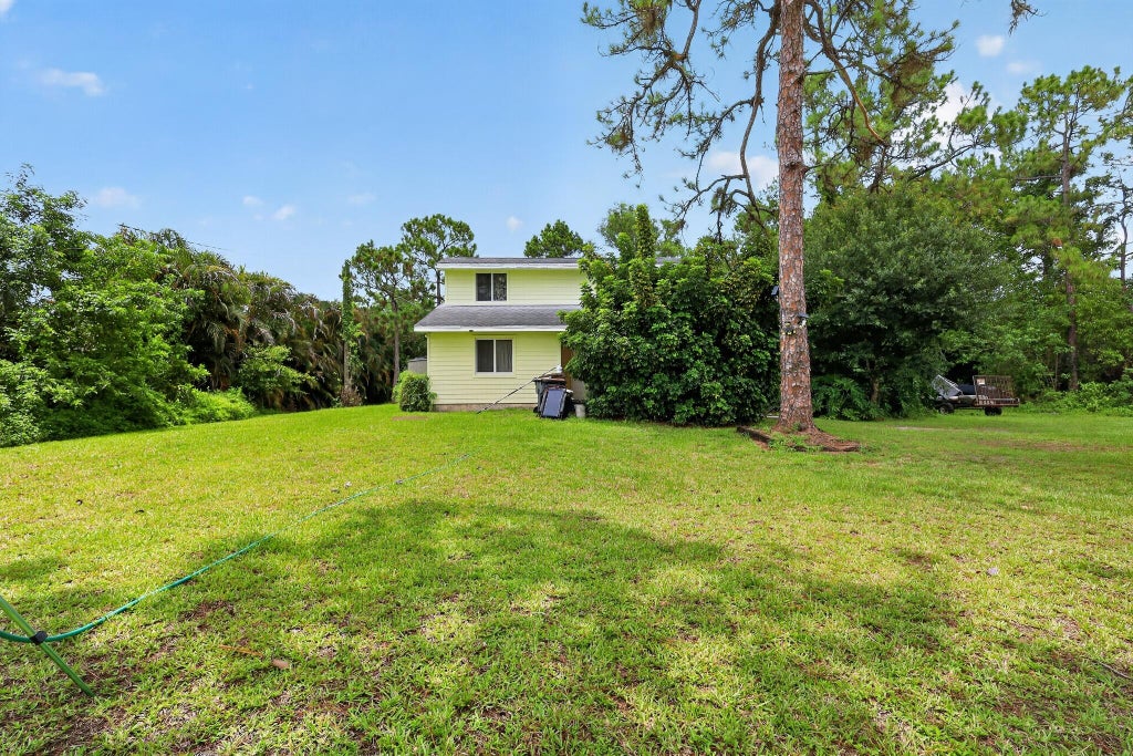 Photo of 16393 E Mayfair Drive E, The Acreage, FL 33470 (MLS # B26046523)