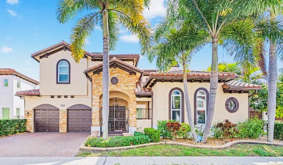 Rarely ever Available for Rental, an Exquisite Waterfront Estate with Private Heated Pool and Canal View! Nestled in the highly sought-after Boutique Artesa community & previous home to Dancehall Superstar, Konshens and Rolling Loud's Adam Hough. Live like these celebrities in your private Fully Furnished Oasis where Luxury meets Sophistication & Tranquility. The bright, open-concept living area boasts high ceilings, elegant Porcelain flooring on the main level, and oversized Impact windows that flood the space with natural light and offer breathtaking views of the pool & canal. The heart of the home is a fully custom, chef-inspired kitchen with professional-grade appliances, top-of-the-line finishes, a large island for casual meals, and a wine cooler.