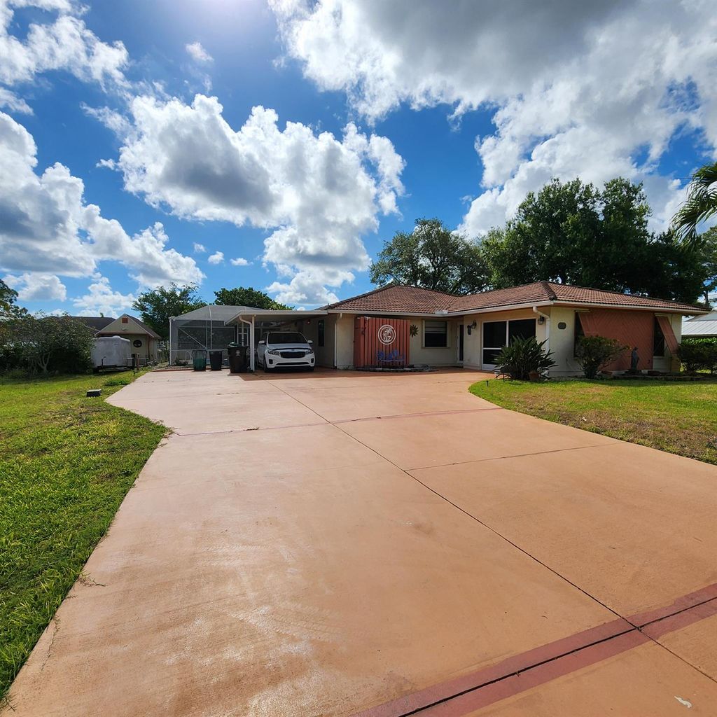 Photo of 2133 SW Kail Street, Port Saint Lucie, FL 34984 (MLS # R10984464)
