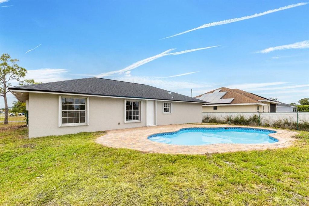 Photo of 930 SW Romaine Lane, Port Saint Lucie, FL 34953 (MLS # R11087377)