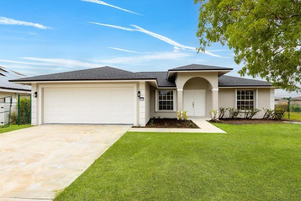 Photo of 930 SW Romaine Lane, Port Saint Lucie, FL 34953 (MLS # R11087377)