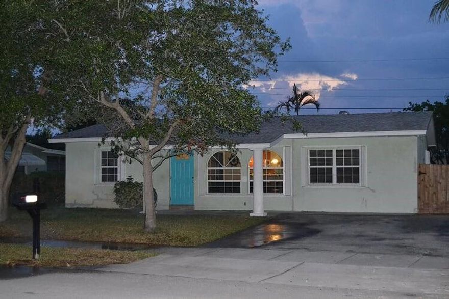 Buyer lost financing!  Updated 3/2 in East Pompano's hottest area!  Bike to the beach or enjoy the large back yard that has room for a pool.  Kitchen and bathrooms have been updated, wood look tiles throughout and newer paint. Fenced yard! Tankless water heater! Great space for entertaining!  Home has a mother in law suite with a kitchenette which is open to the house or can easily be locked off and used as an Airbnb type rental for a great opportunity to supplement income!.