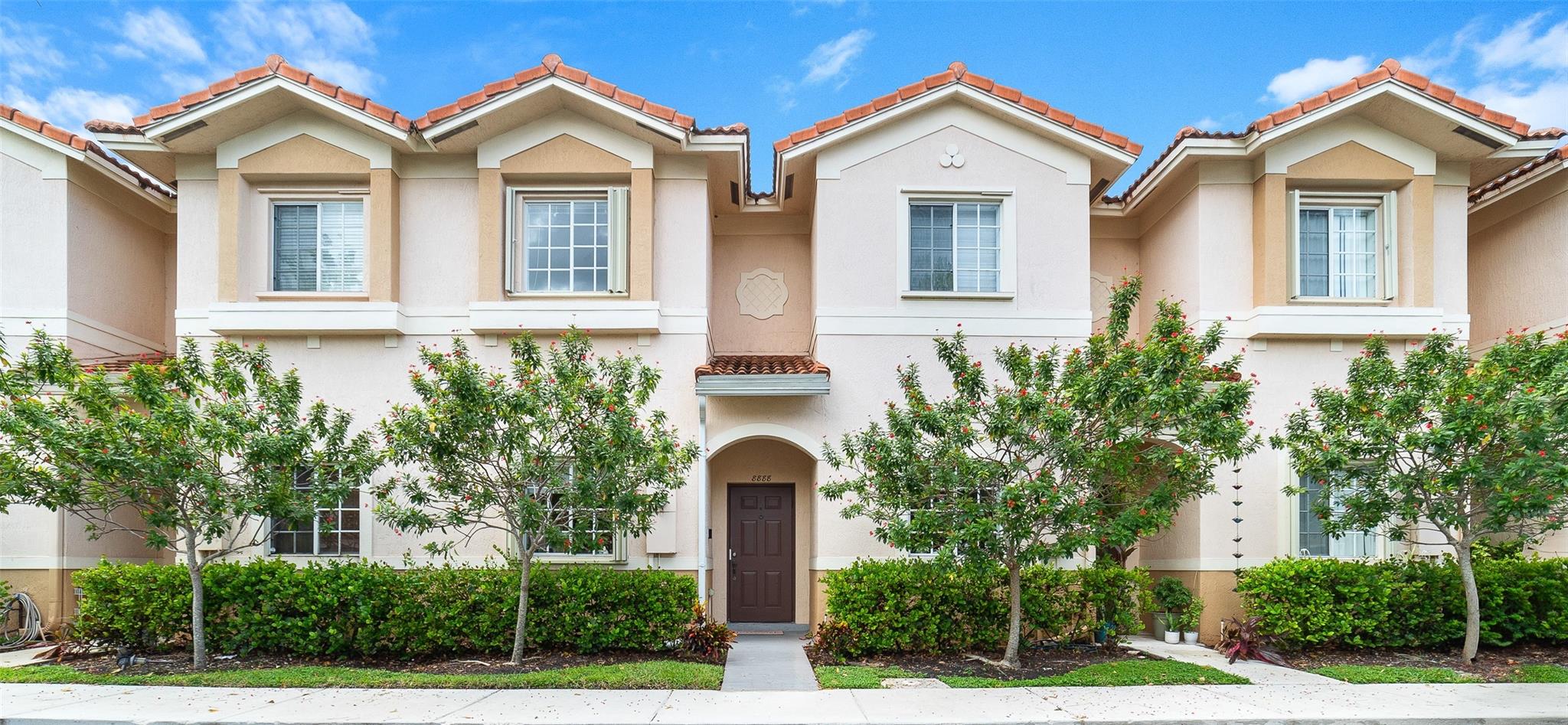 Located in the well-kept Catalina Isles community, this 2-bedroom, 2.5-bath townhouse offers a bright and functional layout across 1,214 square feet. The main level features a covered front porch, an open living space, and a rear courtyard perfect for relaxing or entertaining. Upstairs, both bedrooms offer en suite baths, spacious closets, and the convenience of an upstairs laundry. Additional features include laminate and tile flooring, hurricane shutters, rain gutters, and an outdoor utility closet. The community is gated with a rover guard and offers a clubhouse, pool, cabana, and playground. A wonderful opportunity in a peaceful, centrally located neighborhood that’s close to daily essentials. RENTABLE AFTER 1ST YEAR AND MAY BE RENTED ON A DAILY BASIS. Verify all data with Association.