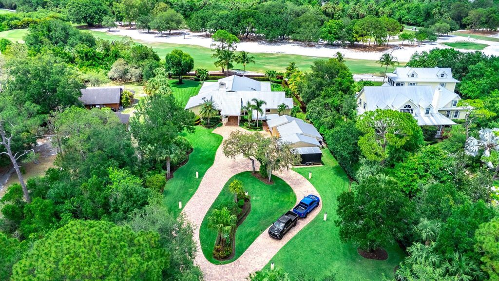 Photo of 1819 SW Crane Creek Ave, Palm City, FL 34990 (MLS # R11101644)