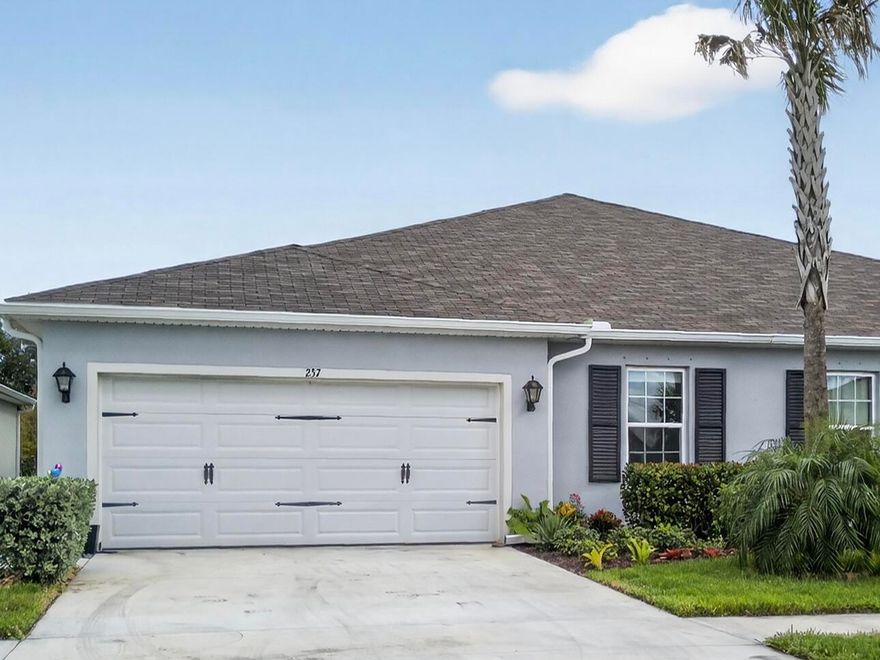 Welcome to Avalon Crossing! This beautifully designed 2023 villa offers 3 bedrooms, 2 bathrooms, and a 2-car garage in a quiet, lower fee HOA community. The open-concept main living area features an inviting layout anchored by a spacious center-island kitchen, perfect for everyday living & entertaining. Private and serene primary suite with a large walk-in closet, plus generously sized secondary bedrooms. Step outside to the screened lanai for relaxed indoor-outdoor living. Community amenities include a clubhouse, sparkling pool, and children's playground. Conveniently located close to I-95 and the Florida Turnpike—and just minutes from nearby shops and restaurants. A rare opportunity to own newer construction in a peaceful neighborhood with low fees and fantastic lifestyle features.