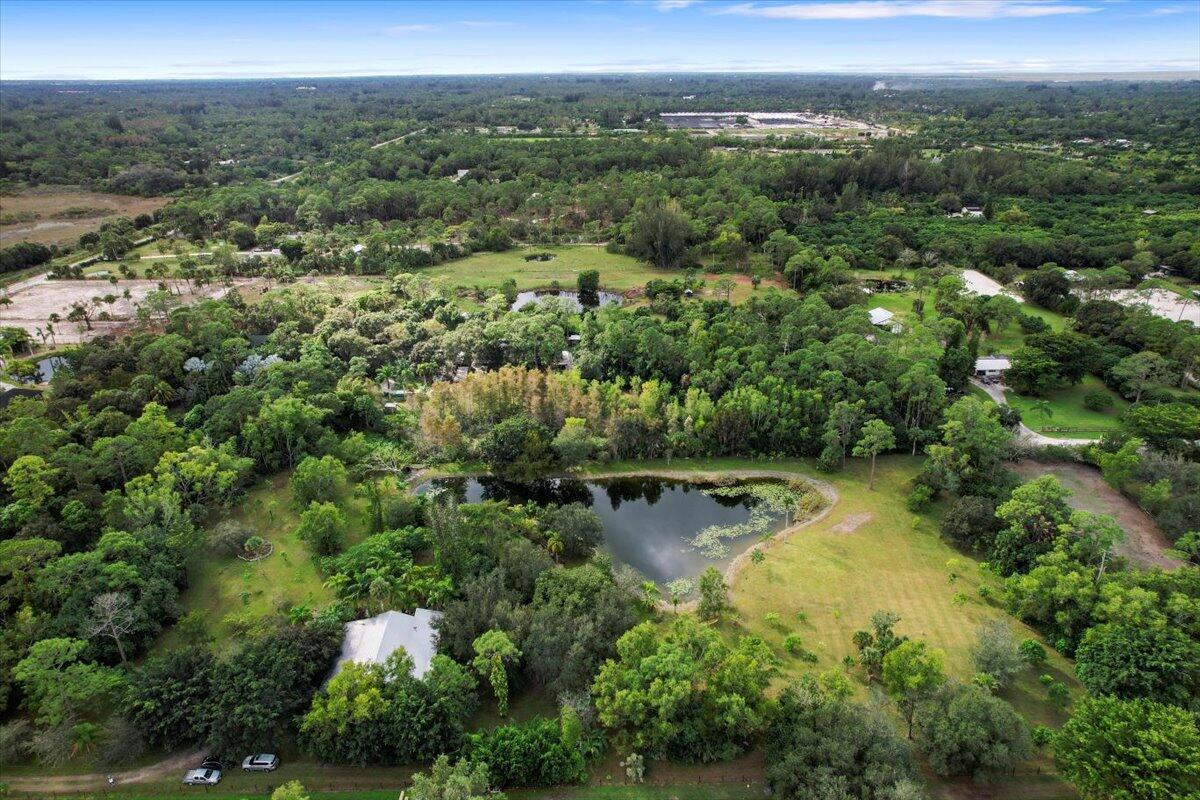 5 Acre parcel with Barn, Prepared House Pad for future home and additional pad prepared for Guest Home/Grooms quarters measures 40 x 24 already has electrical and plumbing. The perfect property for your dream home. This incredible 5-acre property offers the perfect blend of privacy, space, and potential. Tucked away off the main road with additional rear access via Tripp Road off D Road, it provides the ideal setting for those seeking seclusion without sacrificing convenience. The property includes a large 3,600+ square foot barn with a 15' by 30' office space featuring a kitchenette and A/C--perfect for a home business or workshop. There are two additional rooms in the barn for various uses, and a screened-in porch offers a peaceful spot to relax.