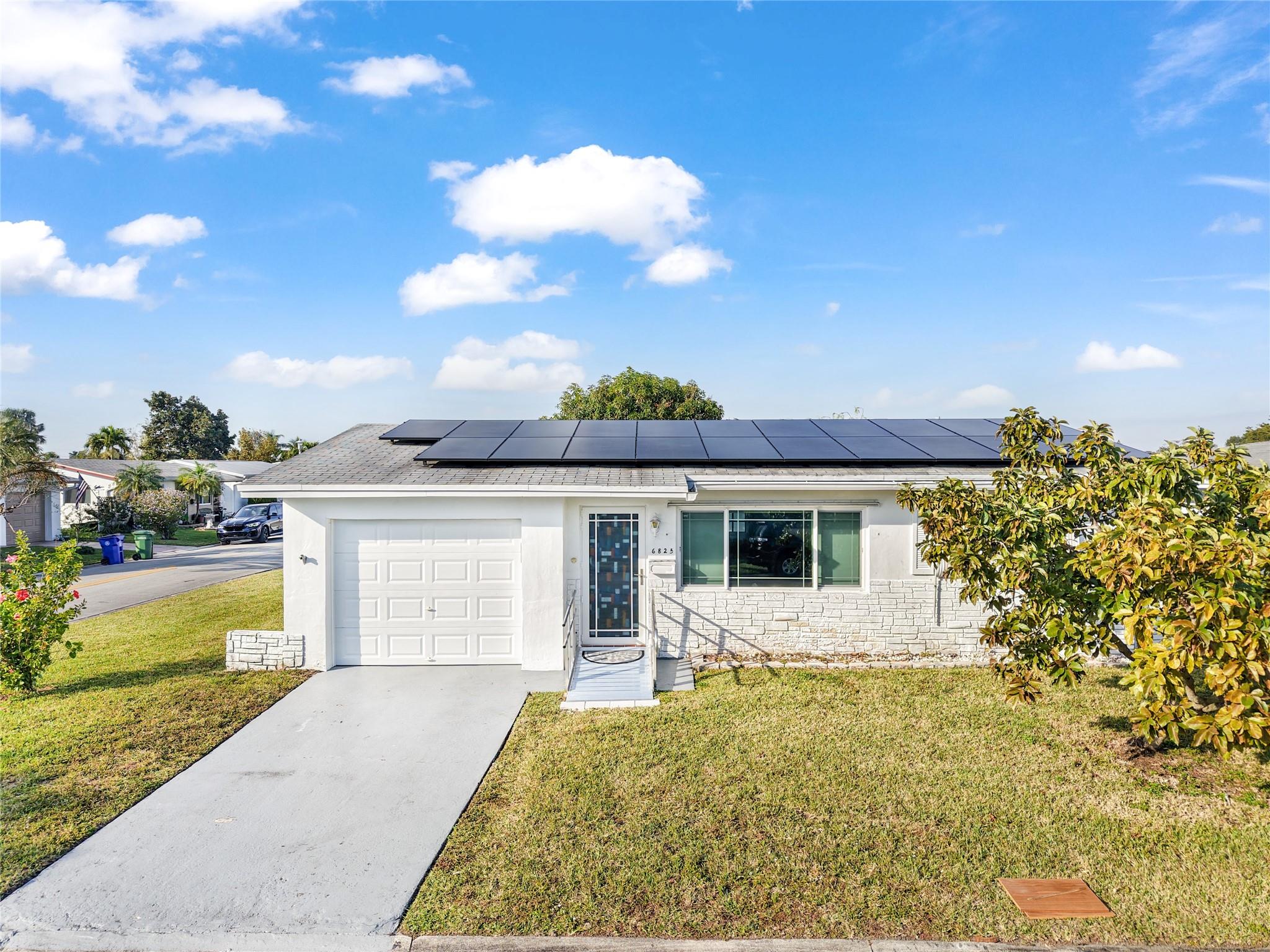 This charming 2-bedroom, 1-bathroom home offers comfort and efficiency in the peaceful Paradise Gardens 55+ community. Featuring a renovated kitchen, impact glass throughout, and solar panels, this home is designed for convenience and energy savings. The spacious Florida room is perfect for relaxing or entertaining, and the 1-car garage provides additional storage. Enjoy very low HOA fees and fantastic community amenities, including a clubhouse, pool, library, and more. Conveniently located near shopping, banks, schools, and major highways. This is a probate sale and subject to court approval.