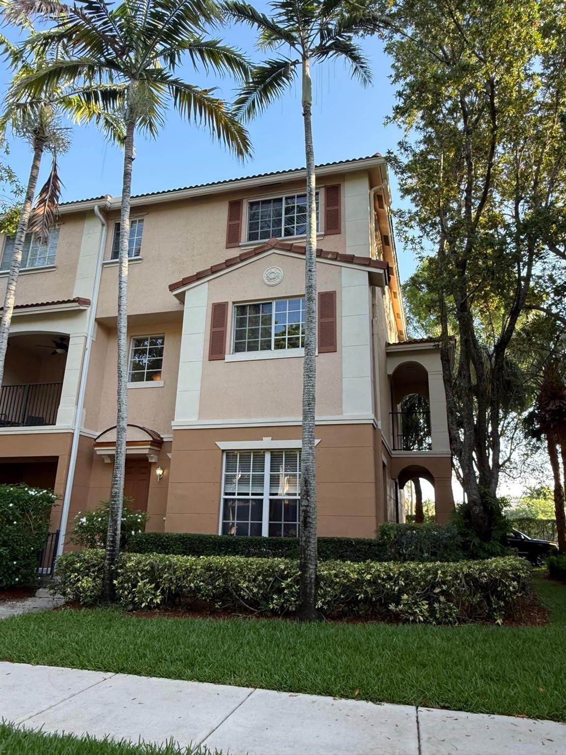 Tri level 3 bedroom end unit home, with oversized 2 Car garage and private driveway backs up to an open field with canal and no neighbors behind you. This well kept property with laminate floors and tile is 2430 sq ft. Ample guest parking, Community park, playground, pool, Volleyball courts, lake and nature trail walk. All 3 bedrooms on 3rd floor along with washer dryer. Enjoy the additional bonus room downstairs that can be used as a office, playroom or living room. Enjoy mornings out on the balcony just off the dining area. Property located 3.5 miles to downtown delray with shopping, restaurants and nightlife on Atlantic Ave and 5 miles to the beach.