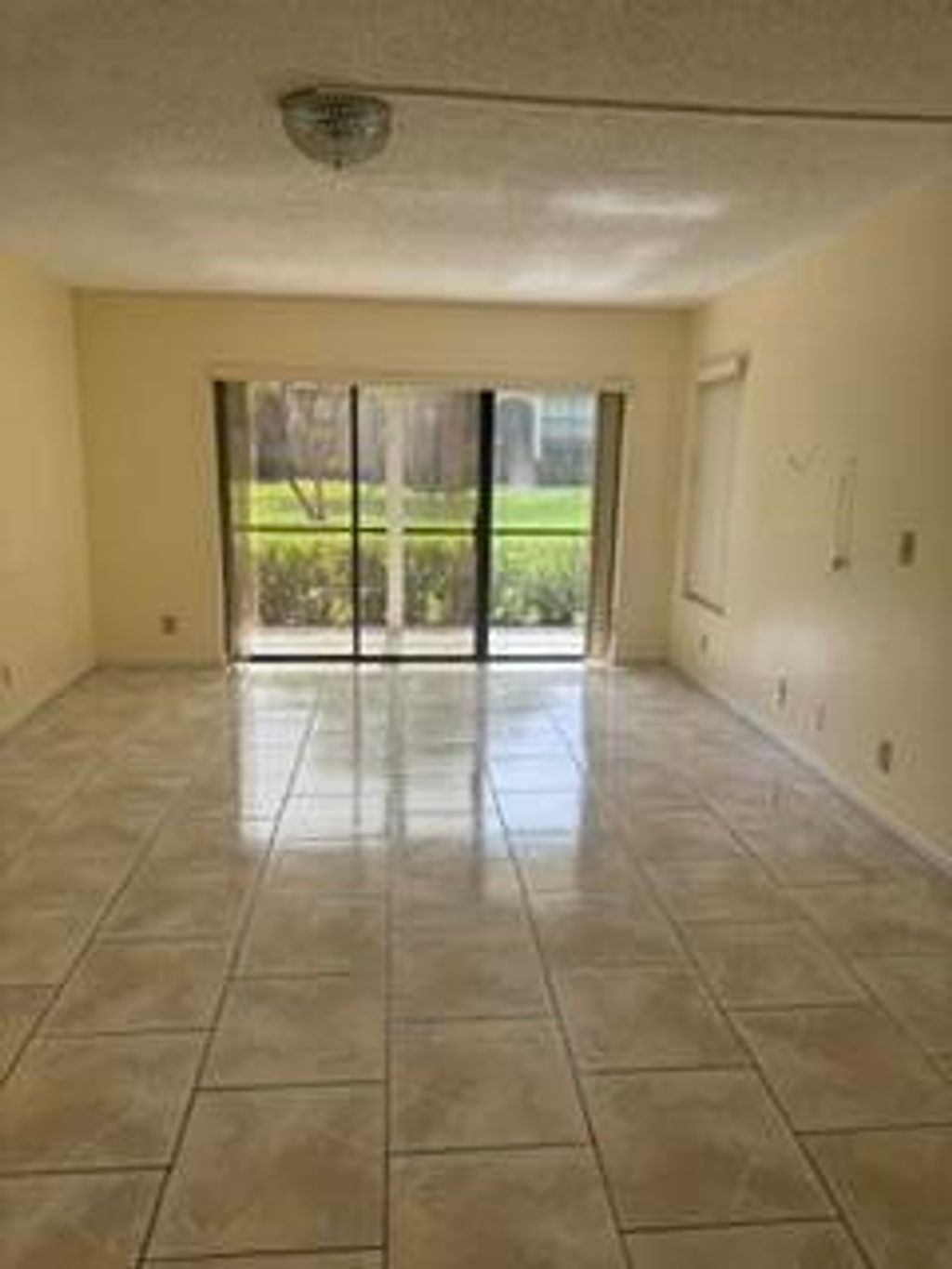 Photo of 720 E Sunny Pine Way #G1, Greenacres, FL 33415 (MLS # B26034768)