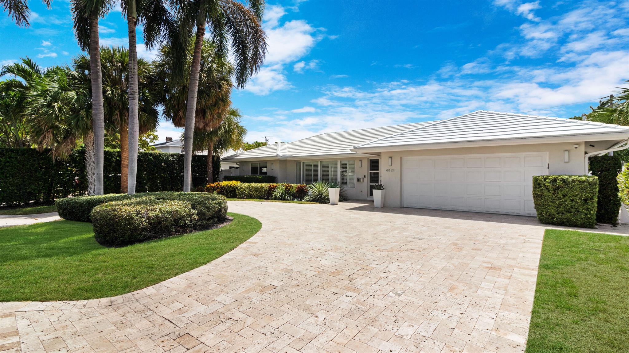 Discover the epitome of South Florida living in this beautifully updated 4-bedroom, 2-bathroom home, ideally located just a 5-minute golf cart ride from the sparkling shores of Lauderdale-by-the-Sea. Boasting a desirable split floor plan, this residence offers privacy and flexibility, with endless possibilities to make it your own.Enjoy incredible curb appeal from the moment you arrive, featuring a large circular travertine driveway and a spacious 2-car garage--offering both luxury and practicality.Step into the bright, air-conditioned enclosed Florida room that seamlessly opens to your private heated saltwater pool, surrounded by elegant travertine decking--a perfect retreat for year-round enjoyment. The cabana bath allows direct access to the pool area, making indoor-outdoor...