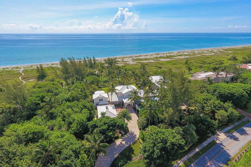 Exceptional oceanfront estate boasts breathtaking views & retreat like amenities creating the signature Jupiter Island experience! Escape to the privacy and tranquility of endless blue water views from the 3 BR, 3.5BA, 3CG, Main House while your guests delight in a 1+BR, 1.5 BA, 2CG Guest House and 2BR, 2BA Guest Cottage. Live the exclusive beachfront lifestyle from the sandy beach to the resort style pool featuring a full outdoor kitchen & bar all surrounded by immaculate tropical landscape that stretches approximately 312 Ft. from the end of the structures to the property line and carefully selected custom finishes both inside & out! The accuracy of this information is subjt. to errors, omissions & changes. An architect should be contacted for actual measurements & specification
