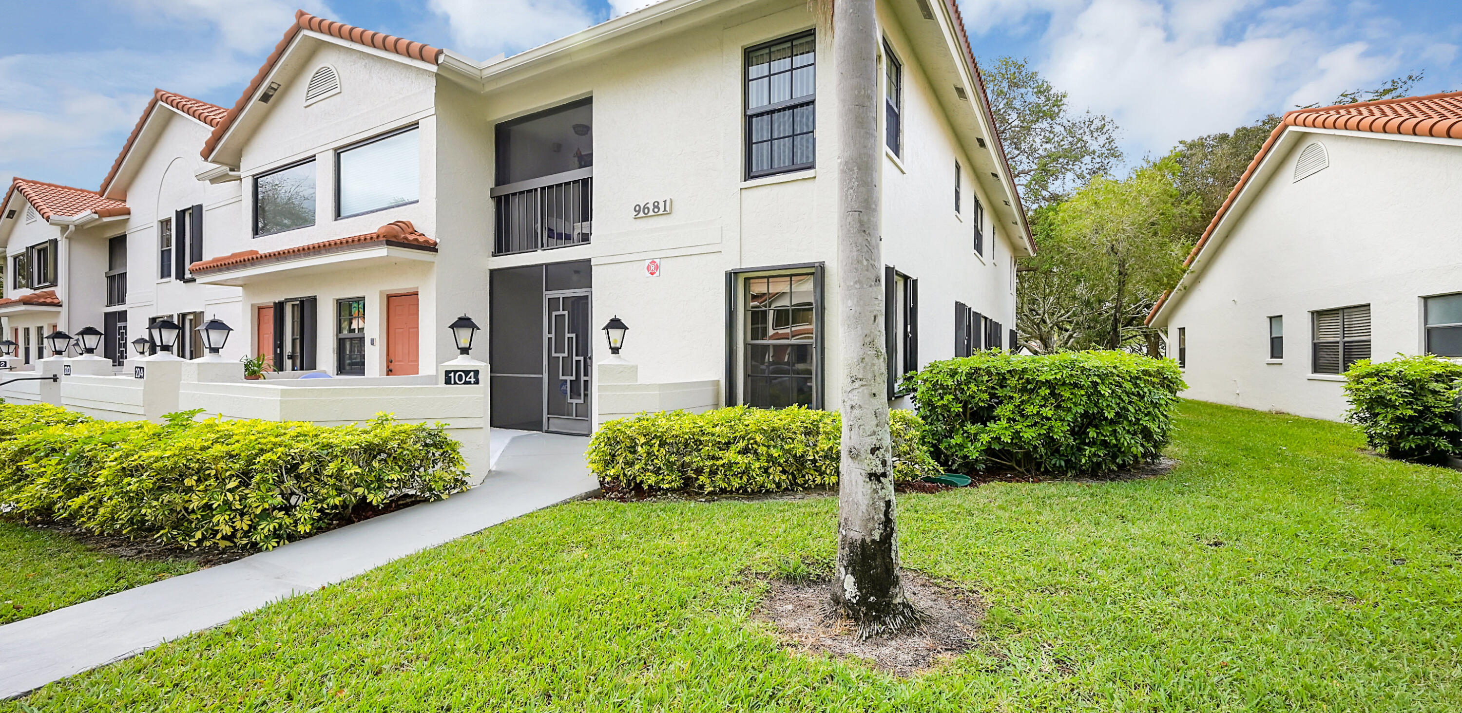 This beautifully renovated first floor end unit boasts a modern open layout. The kitchen features white cabinets, quartz countertops, and stainless-steel LG appliances. Full size washer/dryer. The master bedroom includes a custom walk-in closet, luxury vinyl flooring and a luxurious en-suite bathroom with soaking tub,separate tile shower, porcelain tile floors, quartz countertops and double-sink vanity with plenty of storage. The second bedroom features vinyl flooring and a custom closet. Family room with custom closet, enclosed Florida room, noneighbors behind you. Hurricane shutters on all windows. Assigned parking at your door. Active 55+ community. Pool, clubhouse, entertainment, clubs, fitness center, pickleball, tennis and many activities.