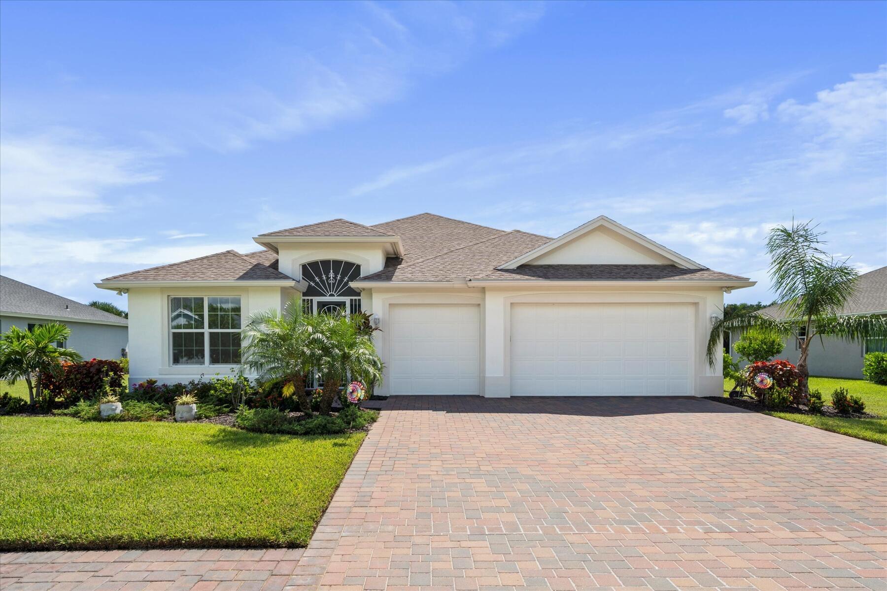 Welcome to this beautifully maintained 4-bedroom, 3-bathroom home in the desirable Paladin Place II of Summer Lake North community. Tucked away on a quiet cul-de-sac, the property features a paver drive, fenced yard, and screened lanai overlooking a garden area with room for a pool. Built with stucco and block, it offers impact windows and doors, a 2021 roof, and solar panels for energy efficiency. The open floor plan is filled with natural light and highlights a stylish kitchen with white cabinets, stainless steel appliances, and a center island. The primary suite includes a spa-like bath, while the large laundry room with utility sink adds convenience. Plantation shutters, volume ceilings, and tasteful finishes give the home a model-like feel.