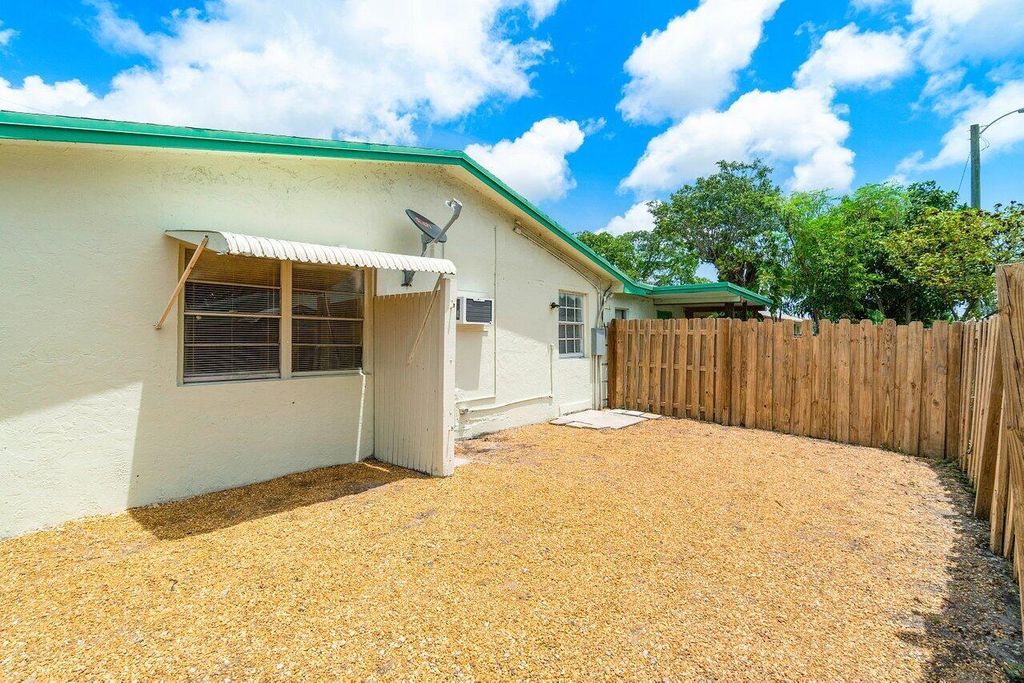 Photo of 3802 Melaleuca Lane #B, Lake Worth, FL 33461 (MLS # R11000426)