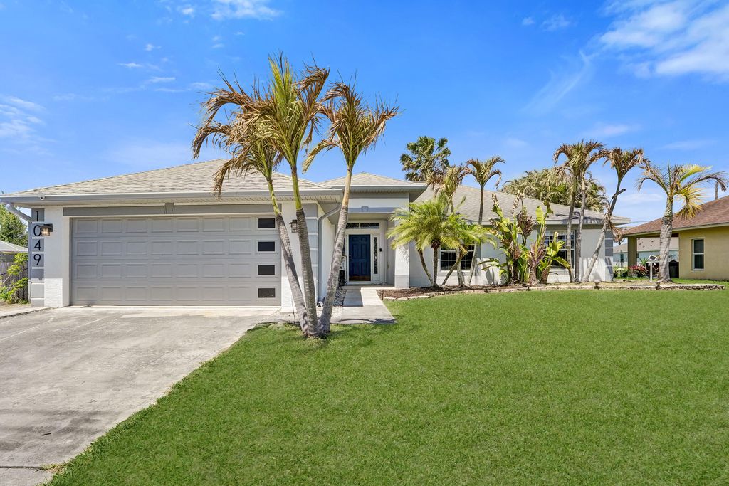 Photo of 1049 SW Alcantarra Boulevard, Port Saint Lucie, FL 34953 (MLS # B26013535)