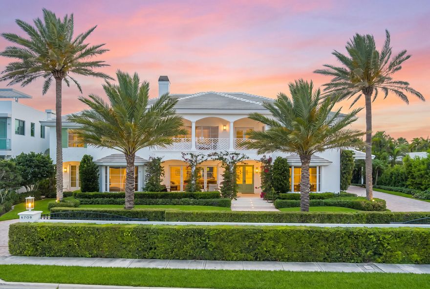 This meticulously renovated waterfront home in the highly sought-after SoSo neighborhood captures panoramic Intracoastal views from a rare 0.45-acre lot with 120 feet of direct water frontage. Reimagined in 2025 by Caroline Rafferty Interiors, the home offers 6,709 square feet of sophisticated living space with a total of 9,535 square feet.  Designed to maximize light and scale, the home features exceptional volume throughout. The main living area is highlighted by soaring ceilings and expansive windows that flood the space with natural light, while a seamless indoor-outdoor flow ensures water views are enjoyed from nearly every room.  The five-bedroom, five-and-a-half-bath layout is both elegant and functional. On the main level, two en-suite bedrooms overlook the water. Upstairs,  the primary suite serves as a private sanctuary, complete with a waterfront balcony, dedicated office, luxurious bathroom, and dual walk-in closets. Two additional en-suite bedrooms, a laundry room, and a TV lounge opening to a balcony with water views, complete the upper level.  The chef's kitchen is thoughtfully appointed for both everyday living and entertaining, featuring a Thermador six-burner gas range, double dishwashers, a wine refrigerator, and a fully equipped butler's pantry with dual ovens and refrigerator drawers.  Outdoor spaces are equally inviting, with a covered loggia overlooking the pool and garden, offering a tranquil and private setting. Additional highlights include a private dock with an approximate 20,000-pound boat lift, elevator, finished three-car garage, and a porte cochère.