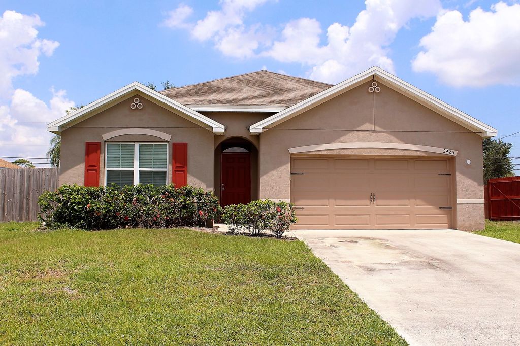 Photo of 2425 SW Falcon Circle, Port Saint Lucie, FL 34953 (MLS # R10800731)