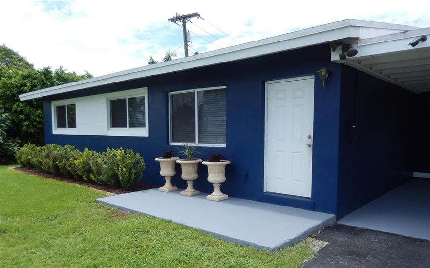 Charming two-bedroom home on an oversized lot. Kitchen overlooks HUGE yard with room for a pool. Almost everything in this home has been upgraded or replaced in the past 8 years: impact windows; roof; wiring; floors; interior walls and ceiling; tankless water heater; appliances; landscaping; extended patio; retractable awning; insulation; fence; and interior and exterior paint. AC from 2009. New insulation and impact windows. All the advantages with none of the headaches. Just 12 minutes to dwntwn Ft Laud